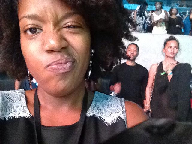 John Legend and Chrissy Teigen kind of photobombs Jennifer D. Laws's picture as she checks for boogers at the On The Run concert at MetLife Stadium - July 11, 2014