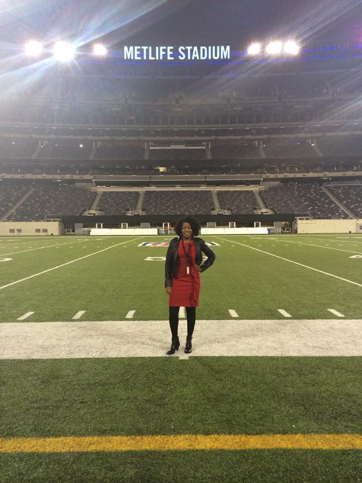 Jennifer D. Laws poses at the 50 yard line at MetLife Stadium. 